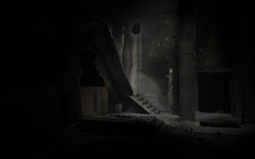 concrete stairs captured in an abandoned dark building